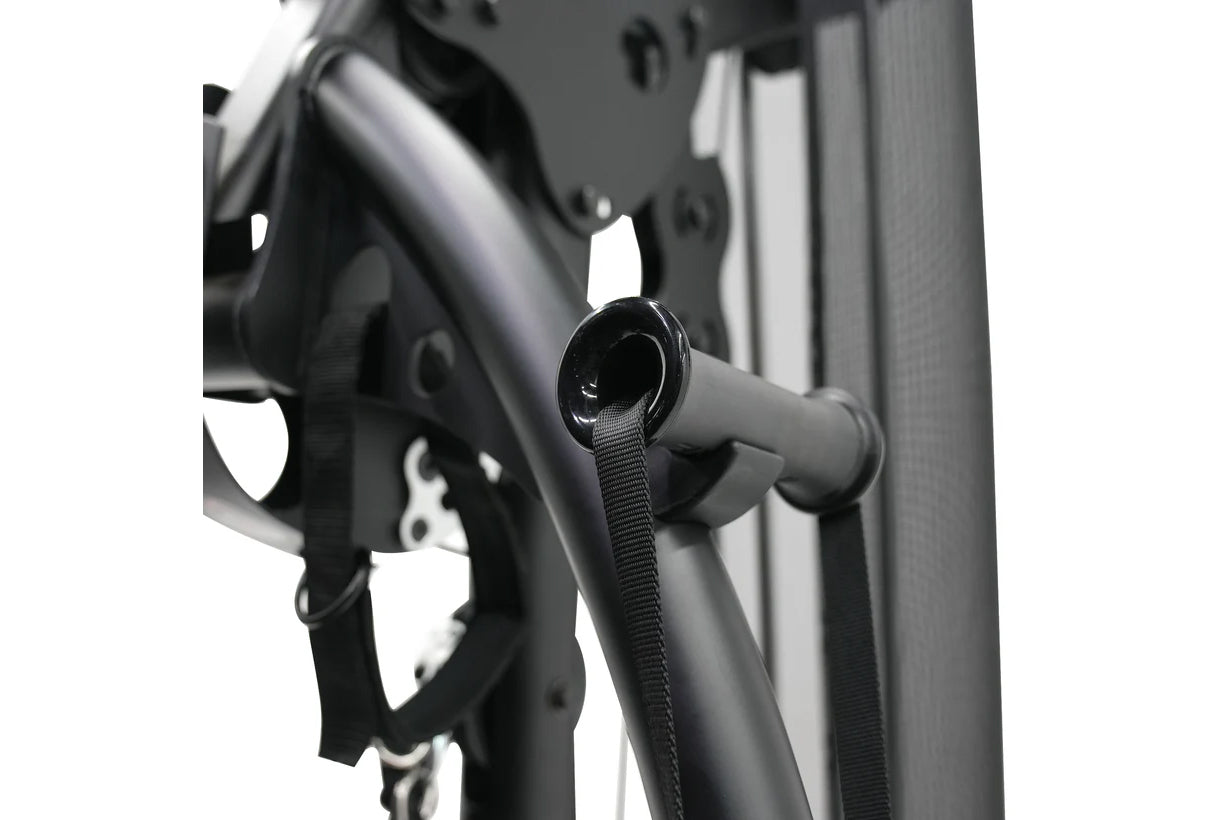 Black and gray multi-gym system detail showing metal frame tubing and adjustment strap mechanism against white background