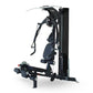 Black and navy Inspire Fitness M2 multi-gym system with cable machine, seat, and leg press attachment on white background