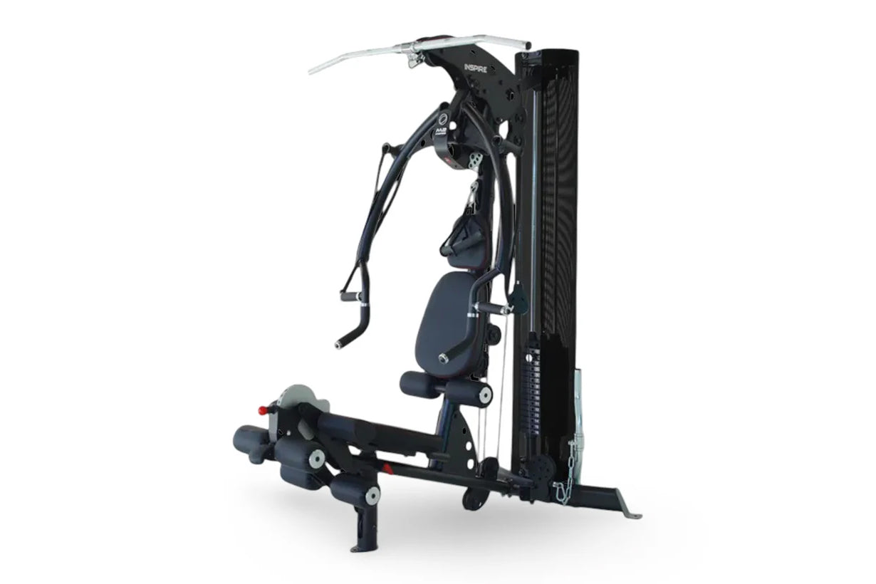 Black and navy Inspire Fitness M2 multi-gym system with cable machine, seat, and leg press attachment on white background