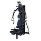 Black multi-gym system with padded seat, multiple resistance arms with handles, and leg press attachment on white background