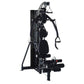 Black multi-gym system with padded seat, cable machine arms, and leg press attachment on white background