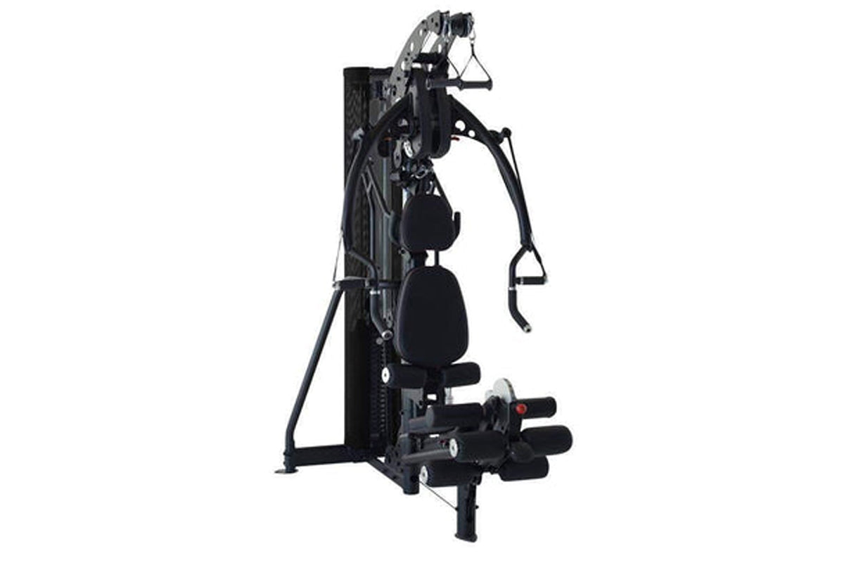 Black multi-gym system with padded seat, cable machine arms, and leg press attachment on white background