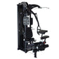 Black and white multi-gym system with padded seat, leg extension platform, chest press arm, and weight stack on white backgro