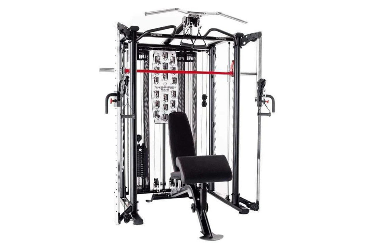 Inspire Fitness SCS Smith Cage System with black and silver metal frame, red horizontal bar, and black padded seat on white b