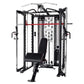 Black and silver multi-functional Smith cage system with cable attachments, red horizontal bar, and black padded bench seat o