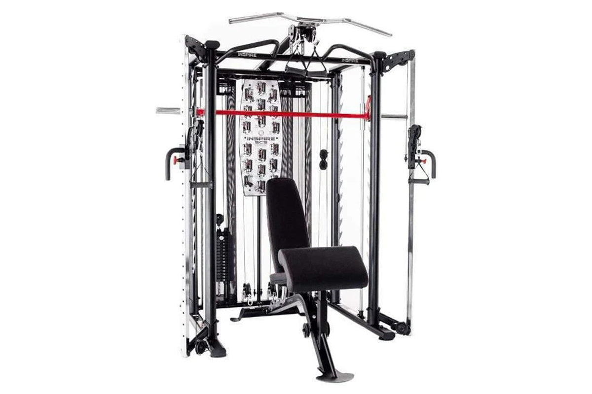 Inspire Fitness SCS Smith Cage System with black padded seat, red horizontal bar, metal frame and cable attachments on white 
