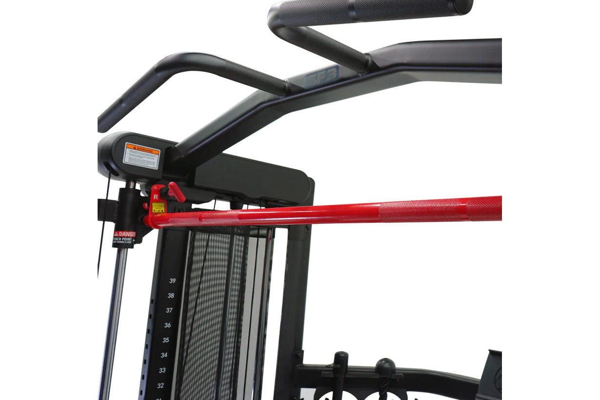 Black and red Smith functional trainer with curved handlebars, numbered weight stack indicator, and emergency stop lever on w