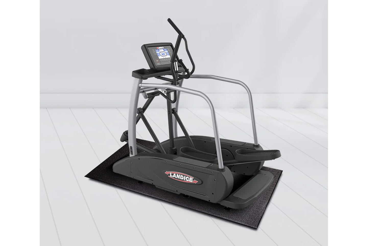 Landice E7 elliptical machine with gray frame, black pedals, digital display console, and black rubber mat on white backgroun