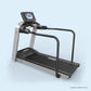 Landice L7 rehabilitation treadmill with black running deck, silver frame, handrails, and digital console on light blue backg