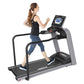 Woman running on Landice L8 treadmill with black frame, gray accents, and digital console display