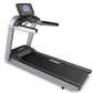 Silver and black motorized treadmill with digital console display, black running deck, and stationary handlebars