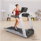 Woman running on silver and black Landice L8 treadmill with digital display in modern home gym