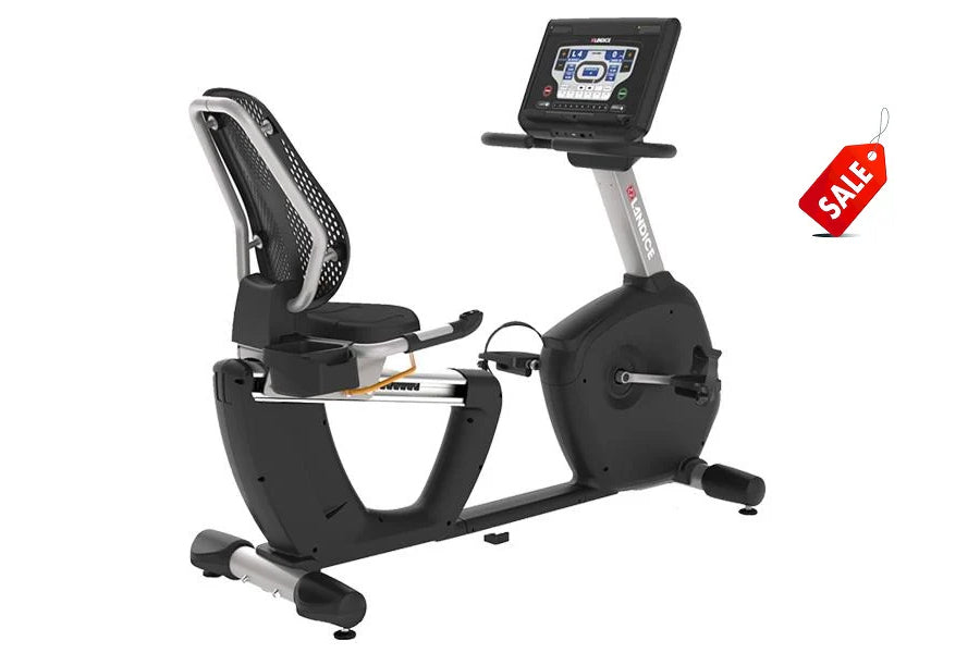 Landice R7 recumbent exercise bike with black frame, padded seat, digital display console, and red sale tag on white backgrou