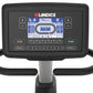 Landice R7 recumbent exercise bike with black frame, digital console displaying workout metrics, and dual handlebar grips on 