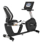 Black and silver Landice R9 commercial recumbent exercise bike with digital console display and mesh backrest, shown on white