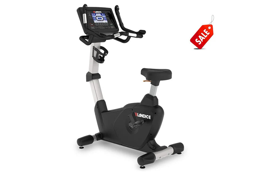 Landice U7 upright exercise bike with black and silver frame, digital console display, and black padded seat on white backgro