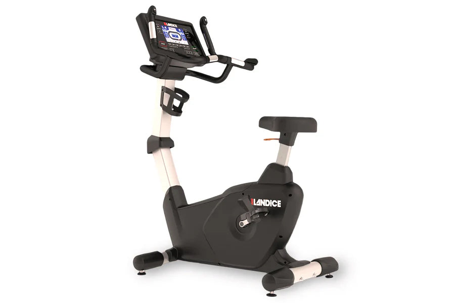 Landice U9 black and white upright exercise bike with digital console displaying metrics on white background