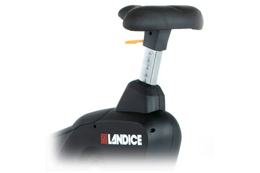 Landice U9 black upright exercise bike with padded seat, silver resistance adjustment column, and orange accent lever on whit