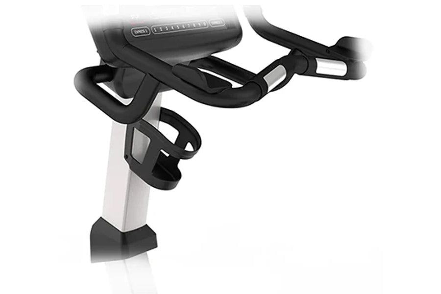 Landice U9 commercial upright exercise bike with black curved handlebars and white frame on white background