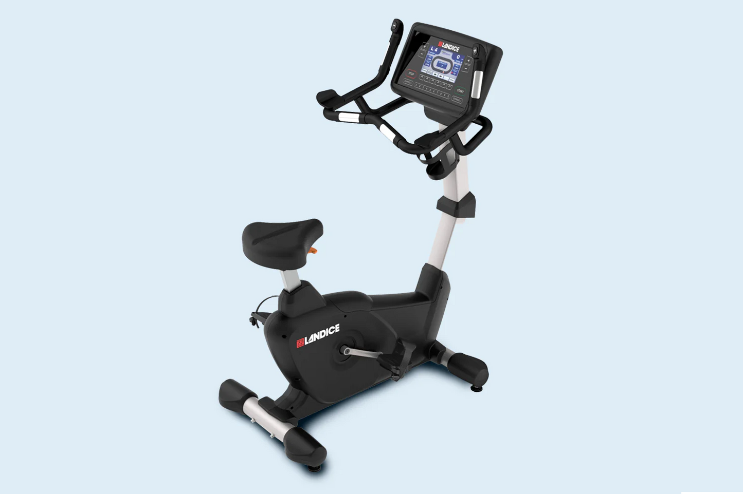 Landice U9 black upright exercise bike with digital display console, white frame, and black padded seat on light blue backgro