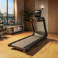 Black Life Fitness Atmos treadmill with digital display in modern gym setting with city skyline view