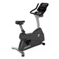 Life Fitness C3 upright exercise bike with black seat, gray frame, digital console with handlebars, on white background