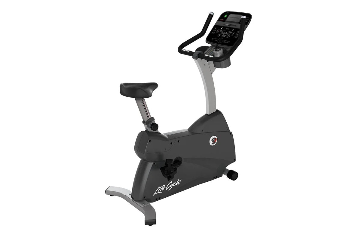 Life Fitness C3 upright exercise bike with black seat, gray frame, digital console with handlebars, on white background