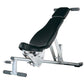 Weight bench with black padded seat and backrest, silver metal frame, leg extension attachment, and adjustable foot rest on w