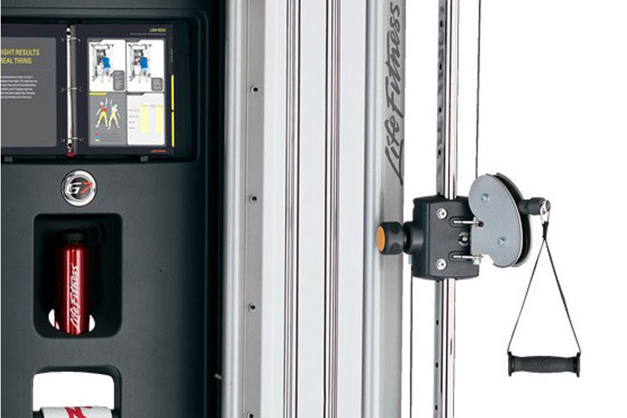 Life Fitness G7 home gym with black and silver frame, showing control panel and pulley system with white handles, on white ba