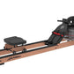 Life Fitness water rowing machine with wood base, black metal frame, padded seat, and transparent water tank on white backgro