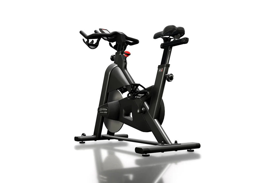Black indoor stationary bike with curved drop handlebars, adjustable seat, and digital console on white background