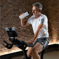 Man exercising on a stationary bike in a gym setting