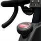 Gym bike handlebar with a red 'STOP' button