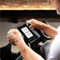 Person using a digital display on a piece of exercise equipment.