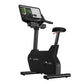 Black Life Fitness upright exercise bike with digital touchscreen display and adjustable seat, on white background