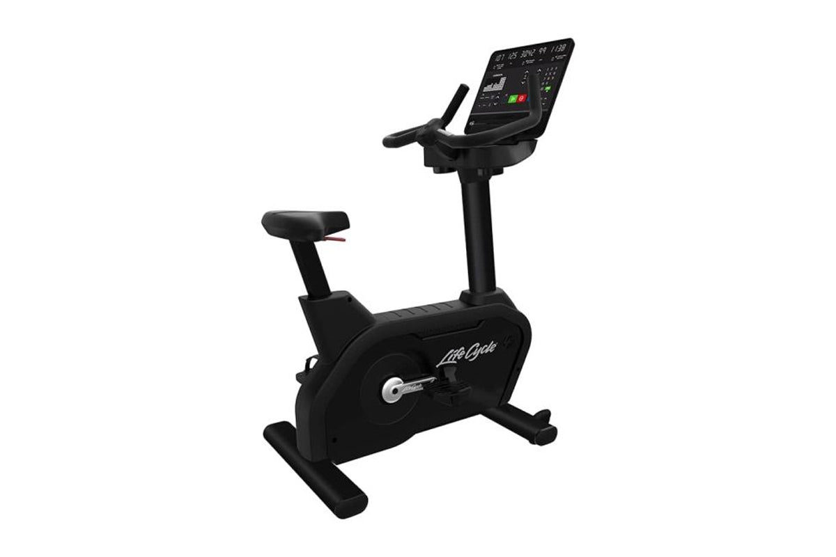 Black Life Fitness Integrity+ upright exercise bike with digital display console and adjustable seat, on white background