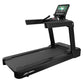Black Life Fitness Integrity+ treadmill with digital touchscreen console displaying workout content, on white background