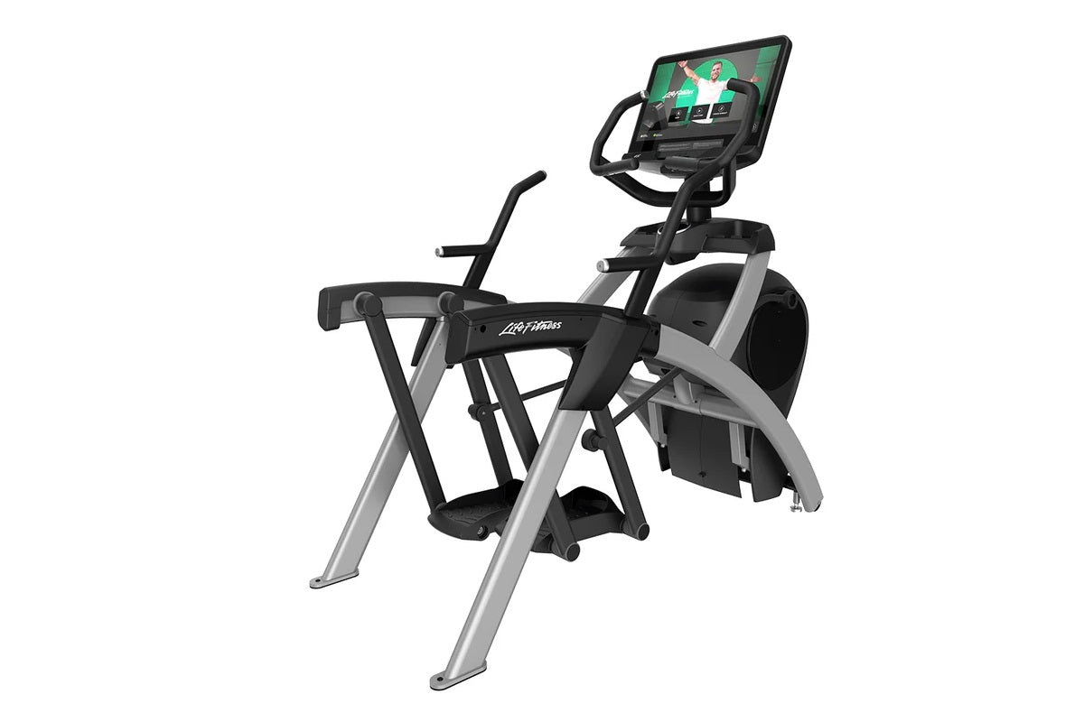 Life Fitness lower body arc trainer elliptical with black and silver frame, foot pedals, handlebar grips, and digital touchsc