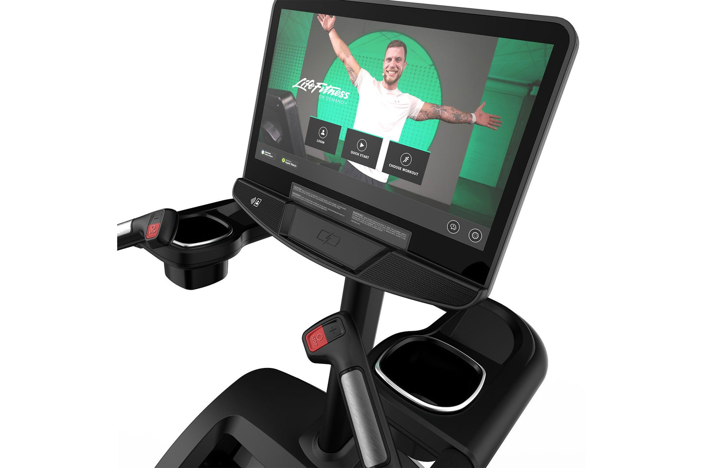 Black and gray stationary climber machine with digital touchscreen displaying fitness workout app and instructor in white shi