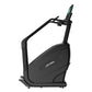 Black Life Fitness PowerMill Climber with green digital display and adjustable handlebars on white background