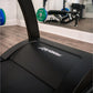 Black Life Fitness Run CX treadmill with branded display panel in gym setting with weights and equipment visible in backgroun