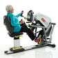 Older adult using SCIFIT StepOne recumbent stepper with white and gray frame, holding handles while exercising, white backgro
