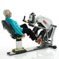 Older woman in turquoise jacket using white and black SCIFIT recumbent stepper with digital display, handlebars and foot peda