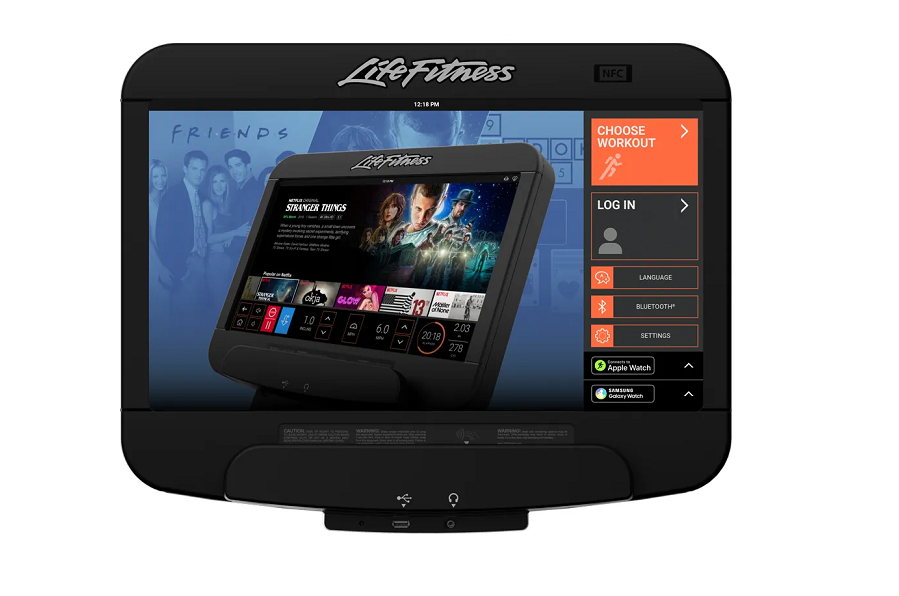 Life Fitness exercise machine with black console displaying streaming content menu, app icons, and workout options on screen