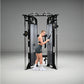 Black and silver dual adjustable pulley machine with woman in black sports bra and shorts using cable attachment, on gray bac