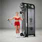 Woman in red sports bra and shorts using black dual adjustable pulley machine with cable handles on gray background