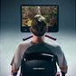 Person using Life Fitness Symbio recumbent cycle with forest trail displayed on screen, viewed from behind
