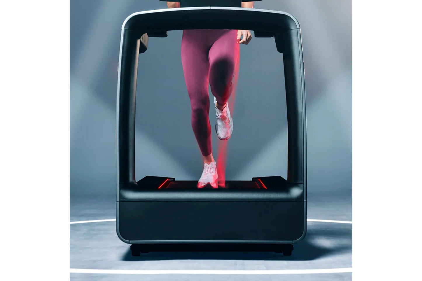 Life Fitness Symbio Runner Treadmill with digital screen showing runner in pink leggings and white sneakers on gray backgroun