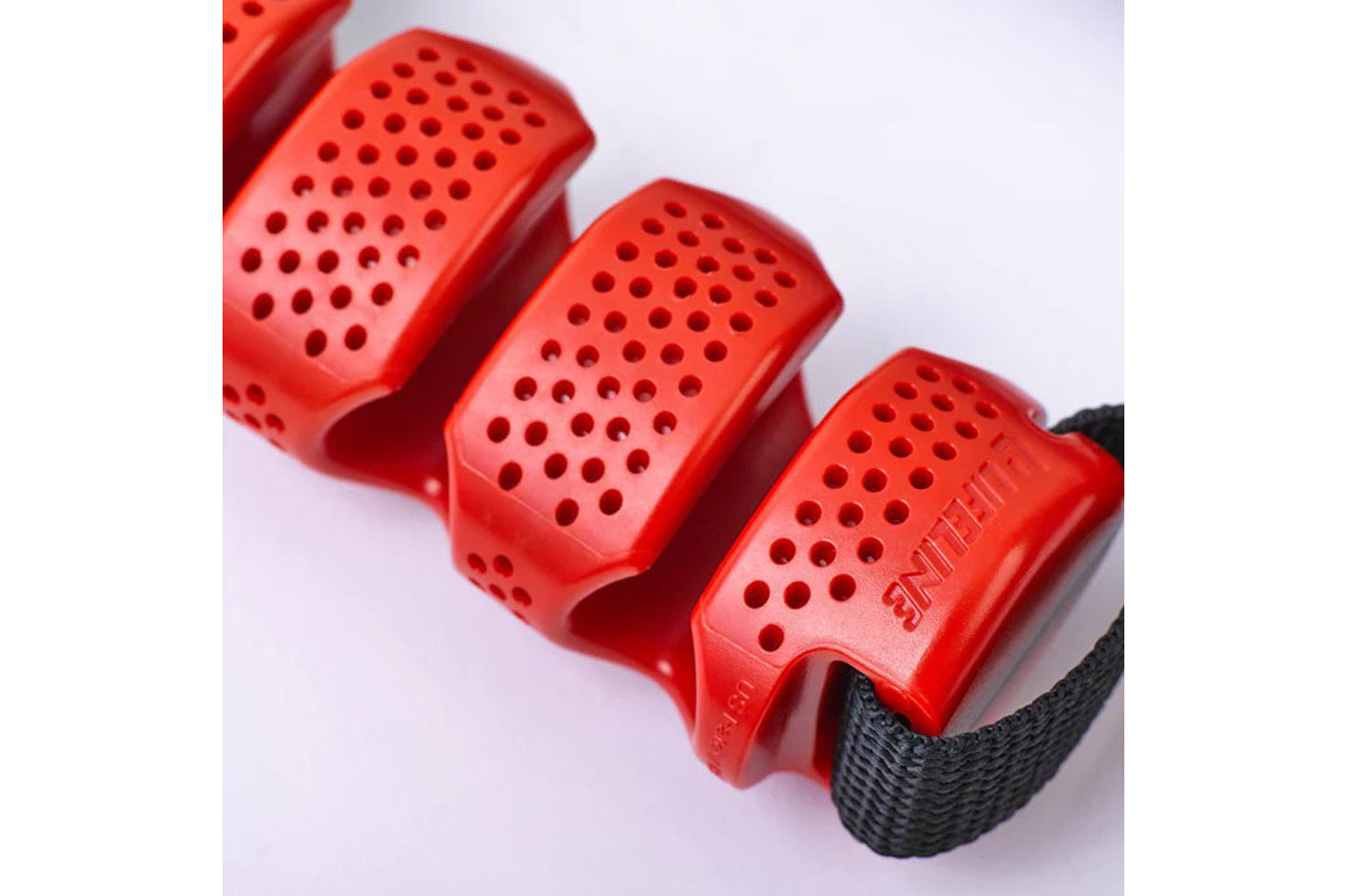 Red pull-up assist bands with perforated design and black fabric straps, displayed on white background