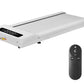 White under-desk treadmill with digital display and black remote control on white background